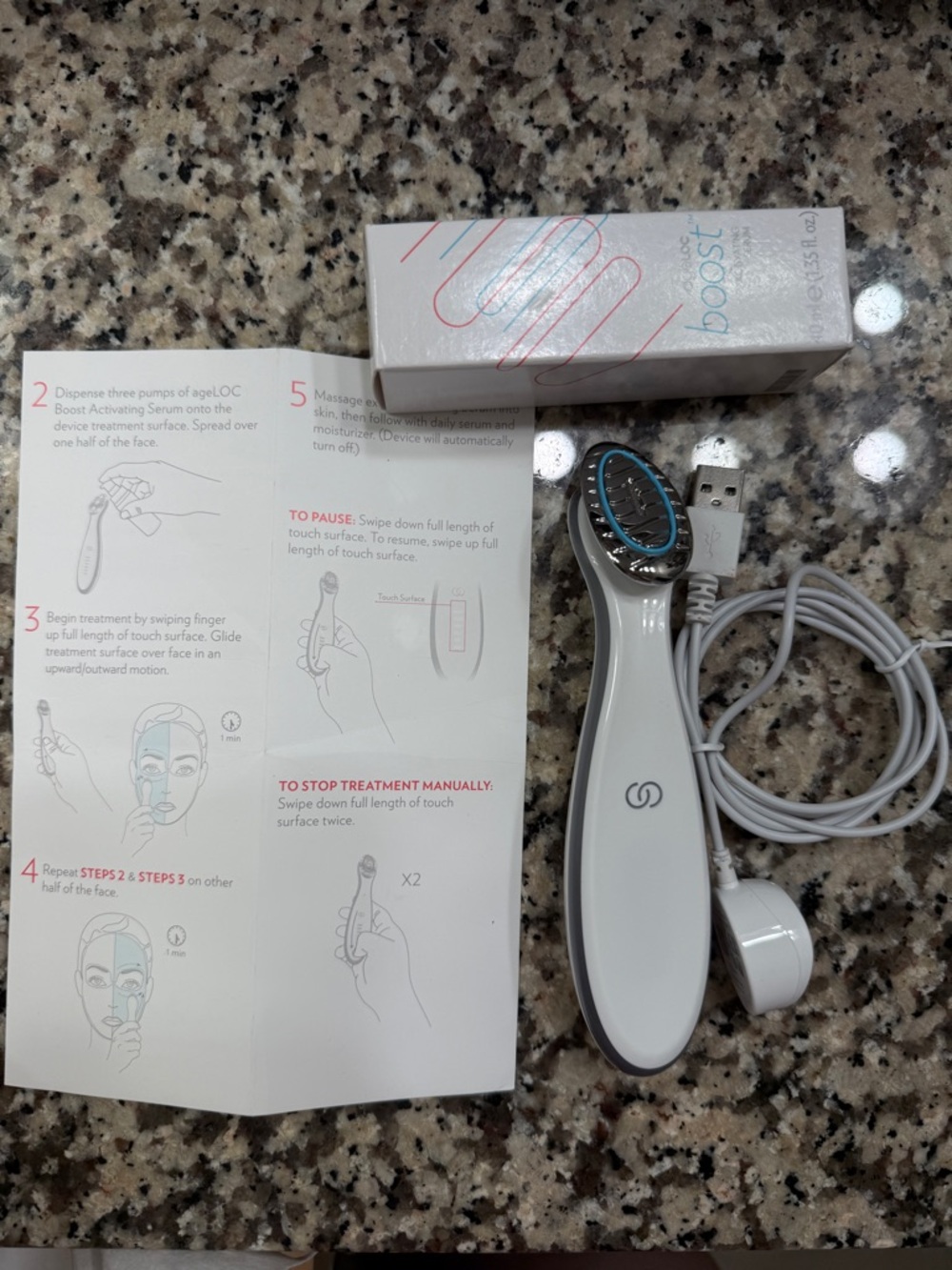Nuskin ageLOC Boost Activating Serum Skin Treatment Device and a bottle of serum
